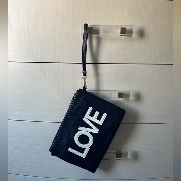 A navy blue shoulder and wristlet, adjustable strap to also wear as a crossbody - Picture 6 of 12